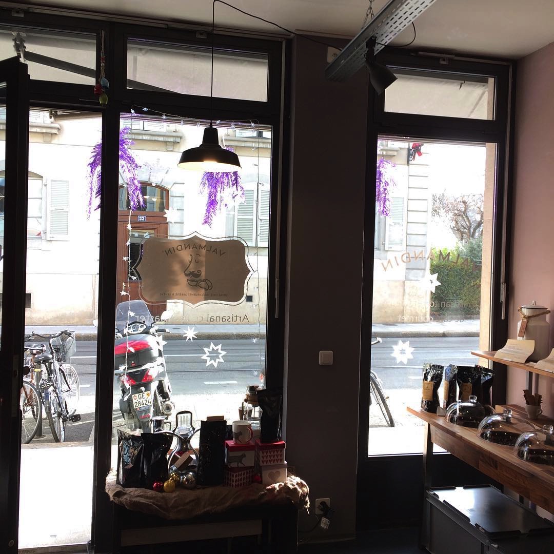Sunny and festive Valmandin coffee roaster's shop window.